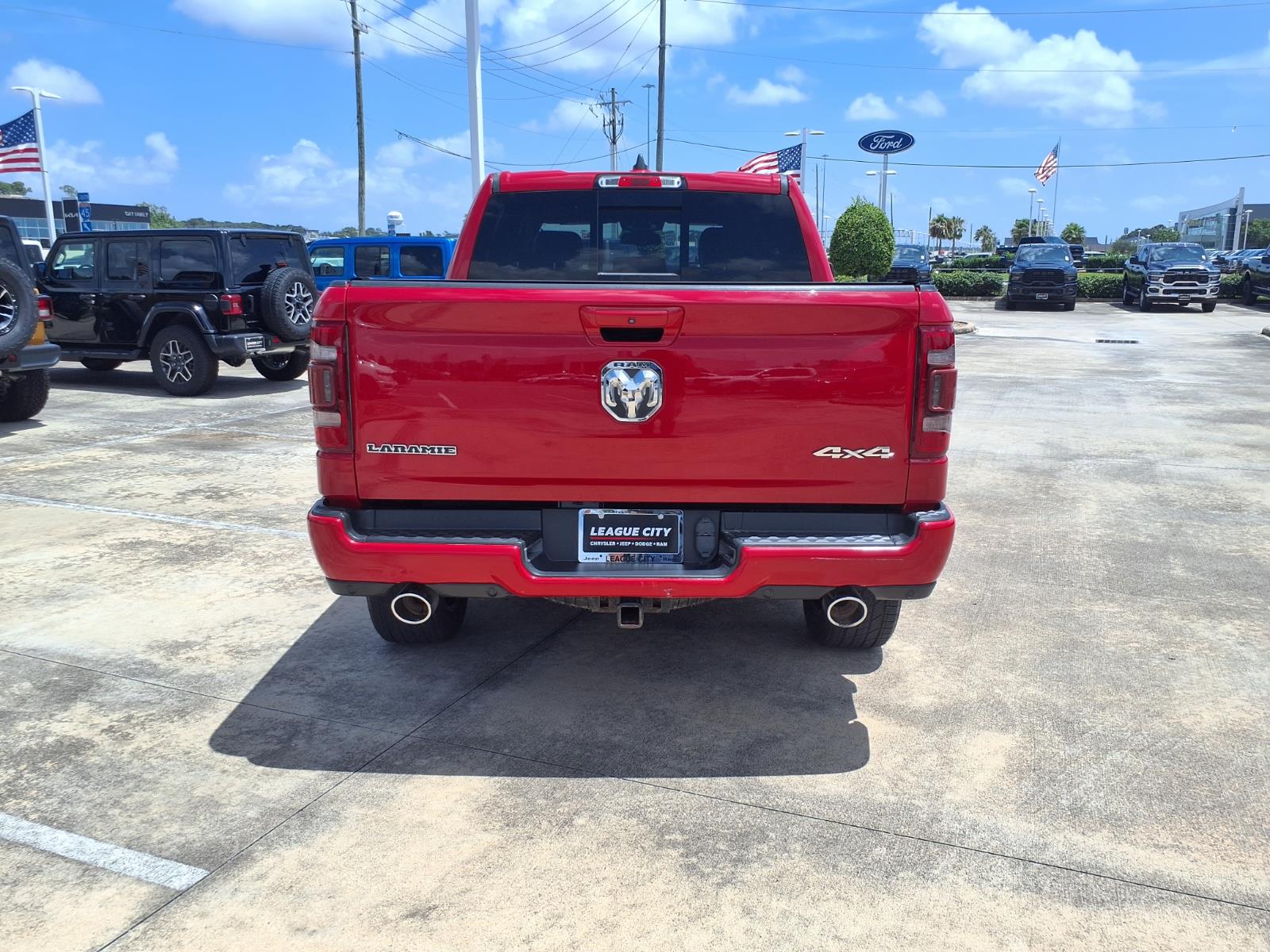 2020 RAM 1500 Laramie Flame Red Clearcoat at League City CDJR