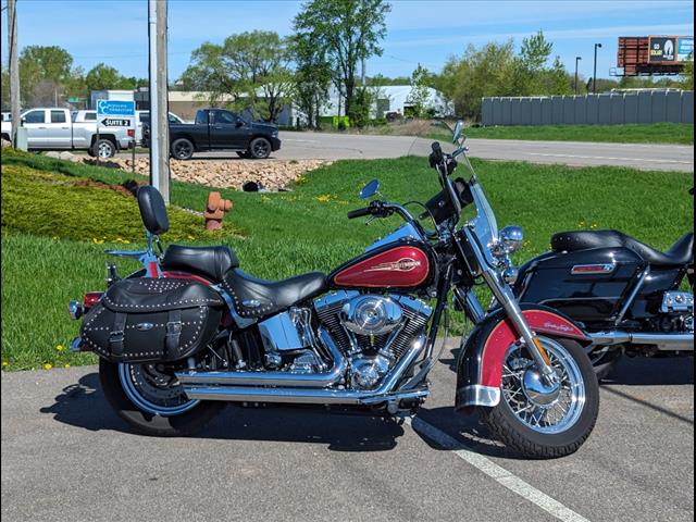 https://cdn.getauto.com/photos/0/231890/2c/1HD1BWB155Y054151-2c.jpg