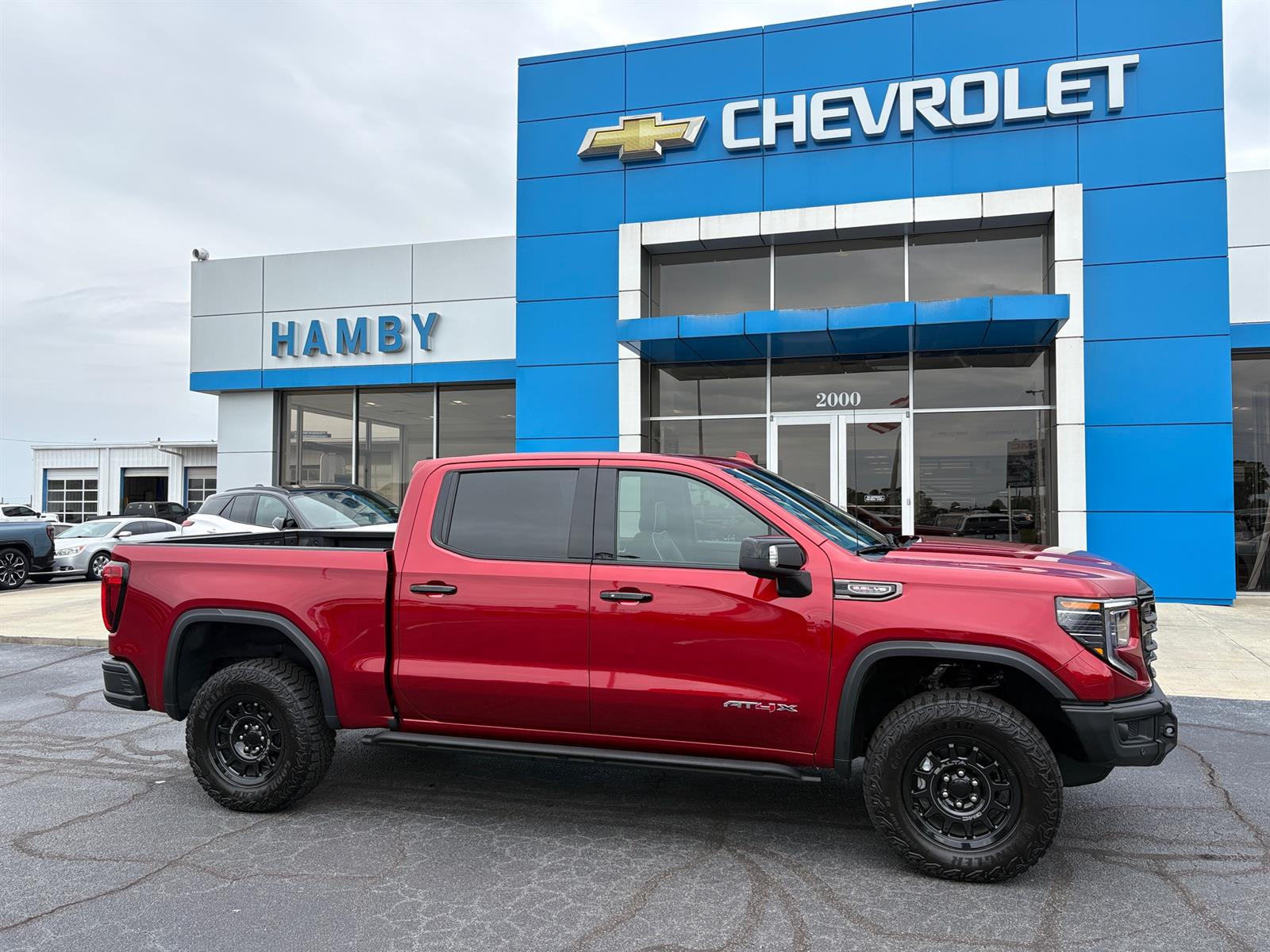Used 2026 Volcanic Red Tintcoat GMC AT4X image 2