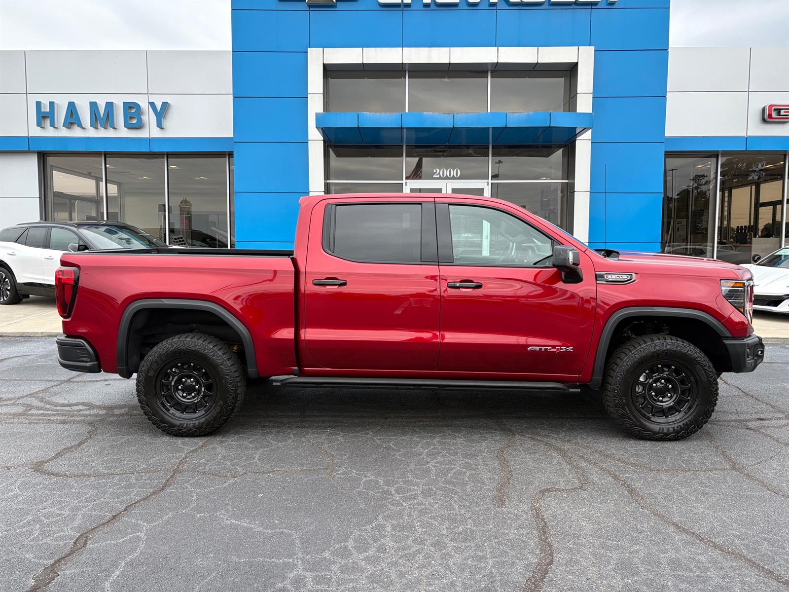 Used 2026 Volcanic Red Tintcoat GMC AT4X image 3
