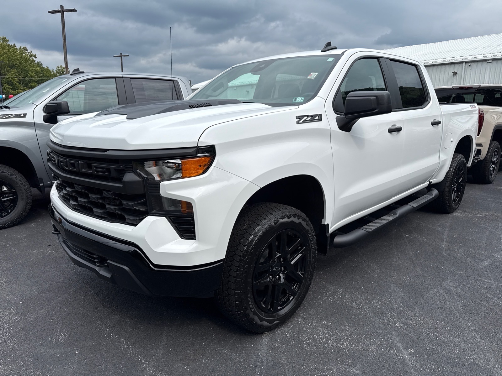2026 Chevrolet Silverado 1500 Custom Trail Boss Summit White Gaz at Memorial Highway Chevrolet